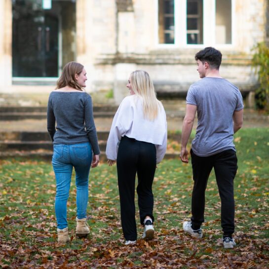 Students walking in Cloisters lawn