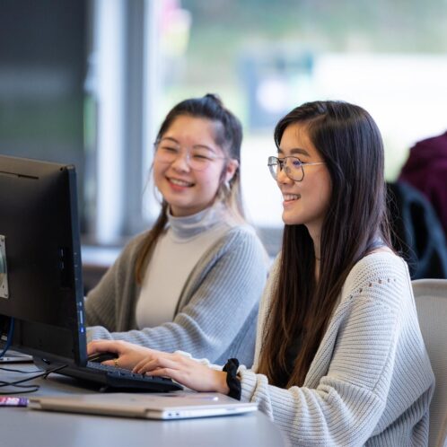 two students sitting at computer