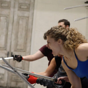 Students using swords in combat module