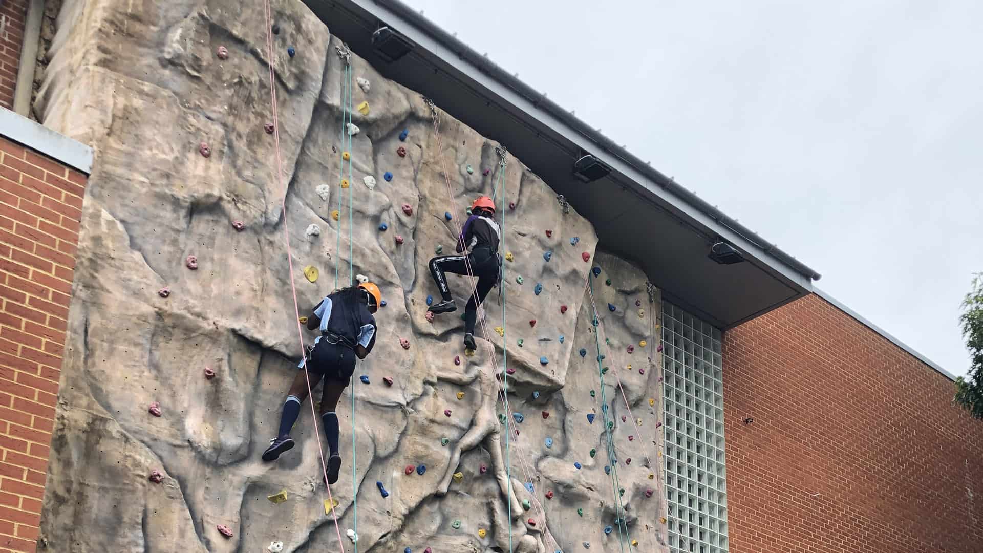 Students on outdoor climbing wall