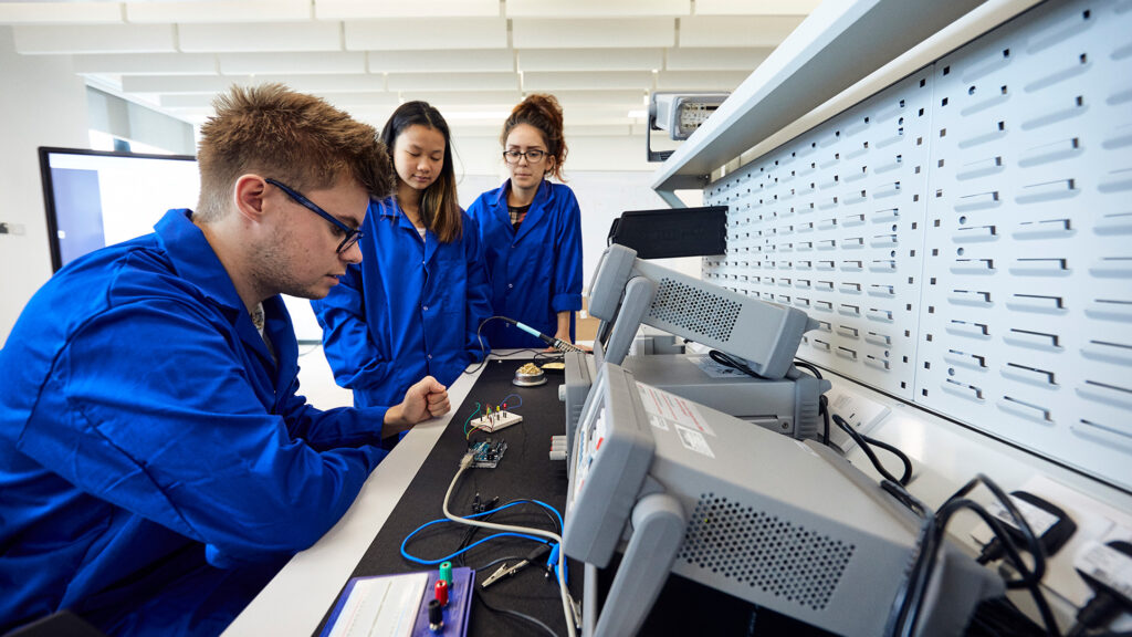 Electrical engineering students working on project
