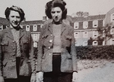 Women in front of bishop otter campus