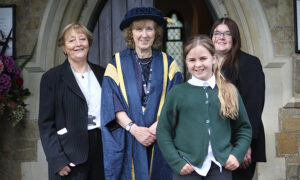 Vice Chancellor Professor Jane Longmore with student and staff from locak primary school