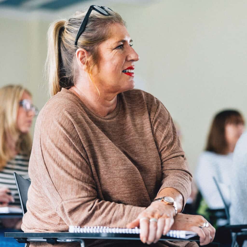 Student smiling in a Counselling class