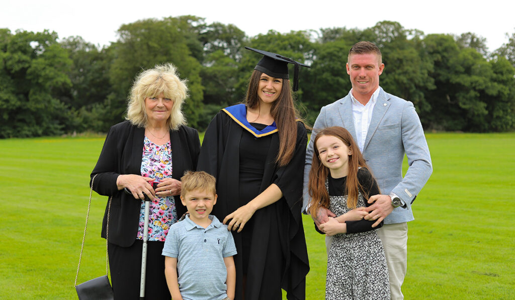 Sophie with her family at graduation