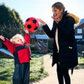 student with child and football