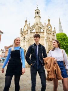 Three students walking through Chichester city centre