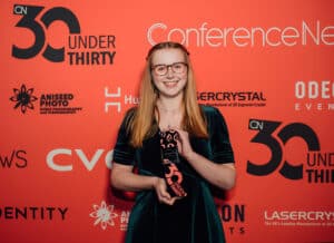 Hannah Jarvis standing with her award
