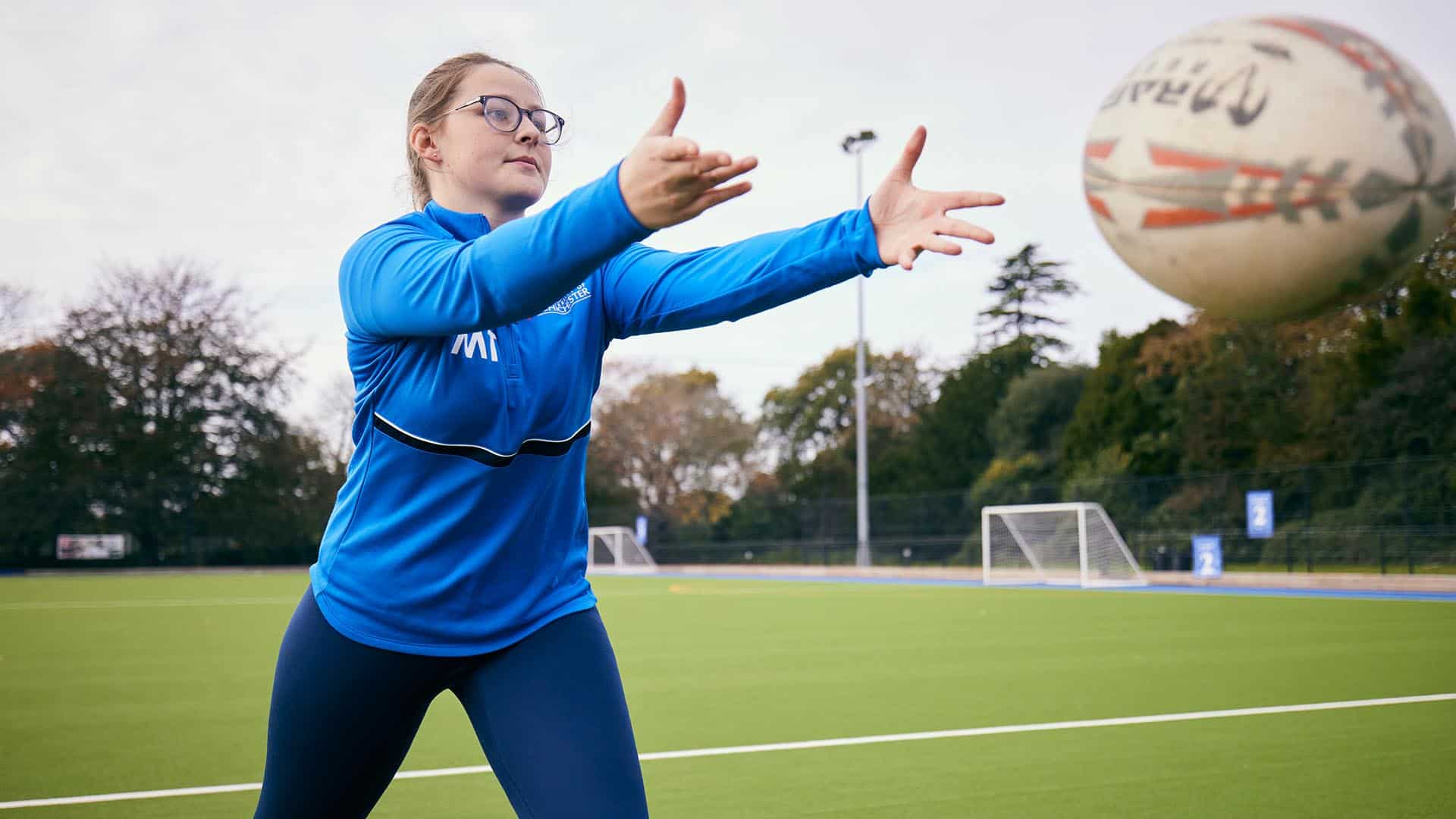 Student participating in rugby training drills