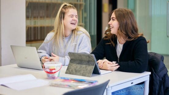 education students sat in a lecture smiling