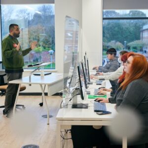students sat at computers in an engineering lecture