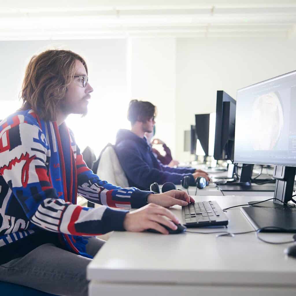 students sat at computers in an engineering lecture