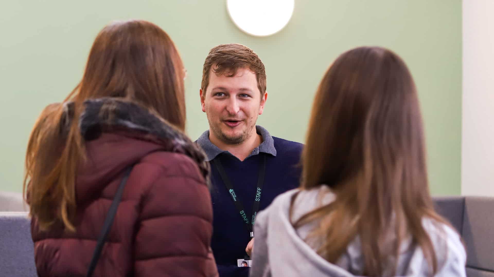 Open Day visitors speaking to a member of staff