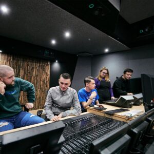 a group of students together in the editing suite