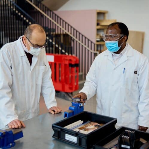 Engineering students using equipment in the workshop