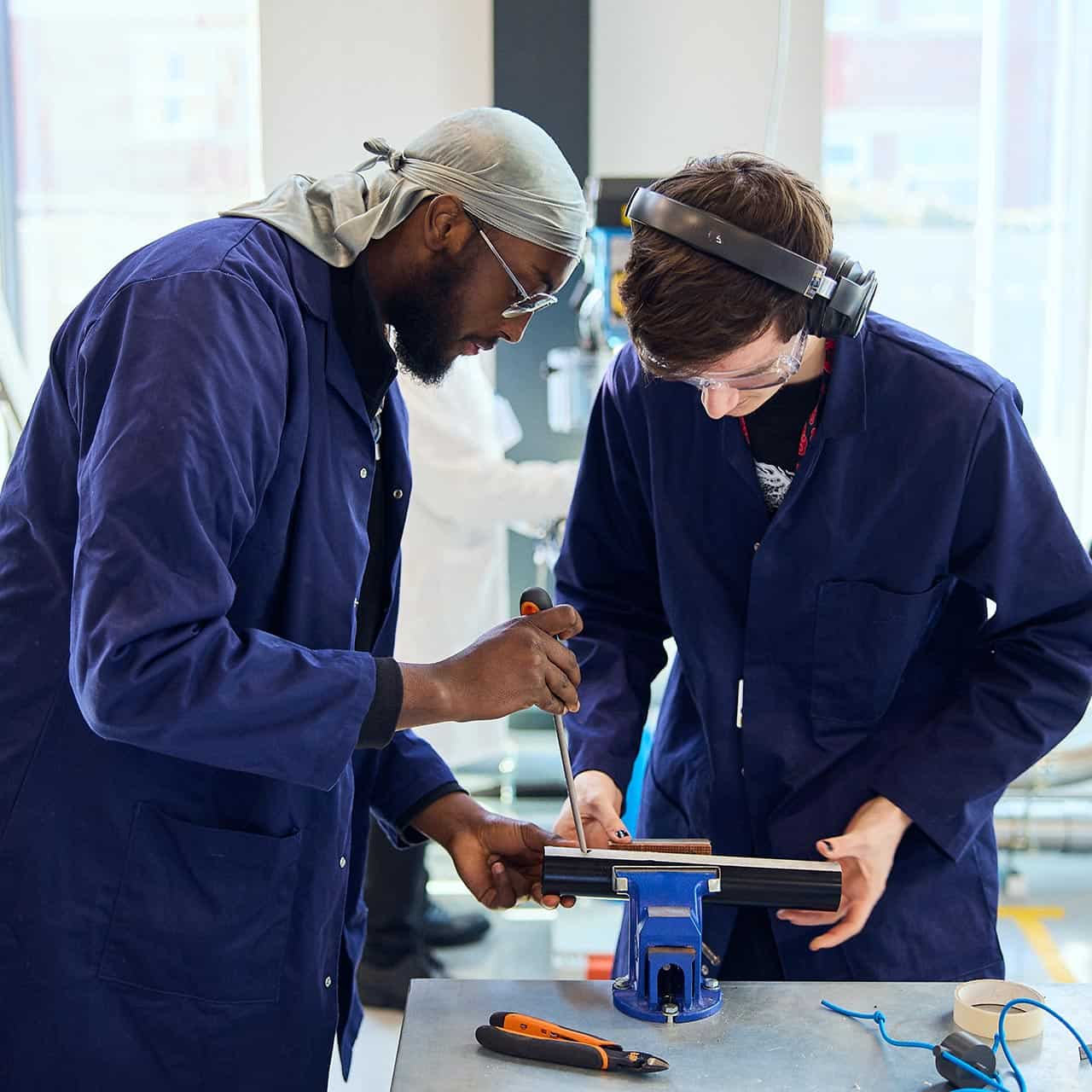 Engineering students working together in the workshop