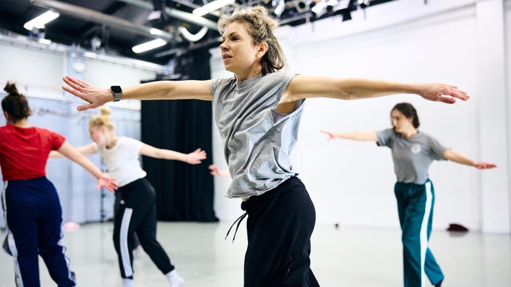 Dance teacher teaching the dance students