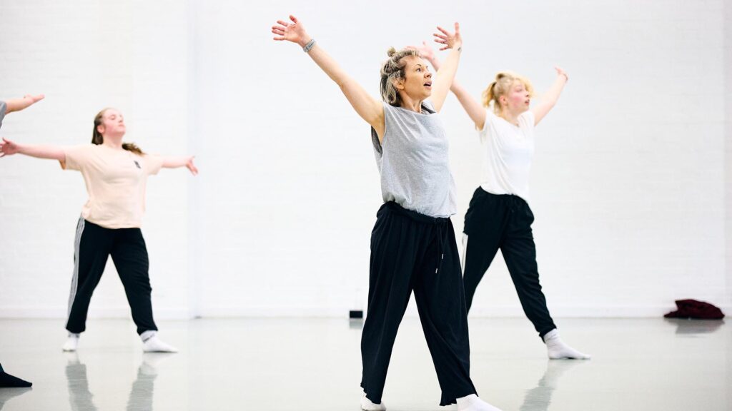 Dance teacher teaching the dance students