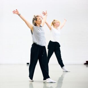 dancing lecturer showing students moves