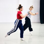 dance lecturer teaching a student