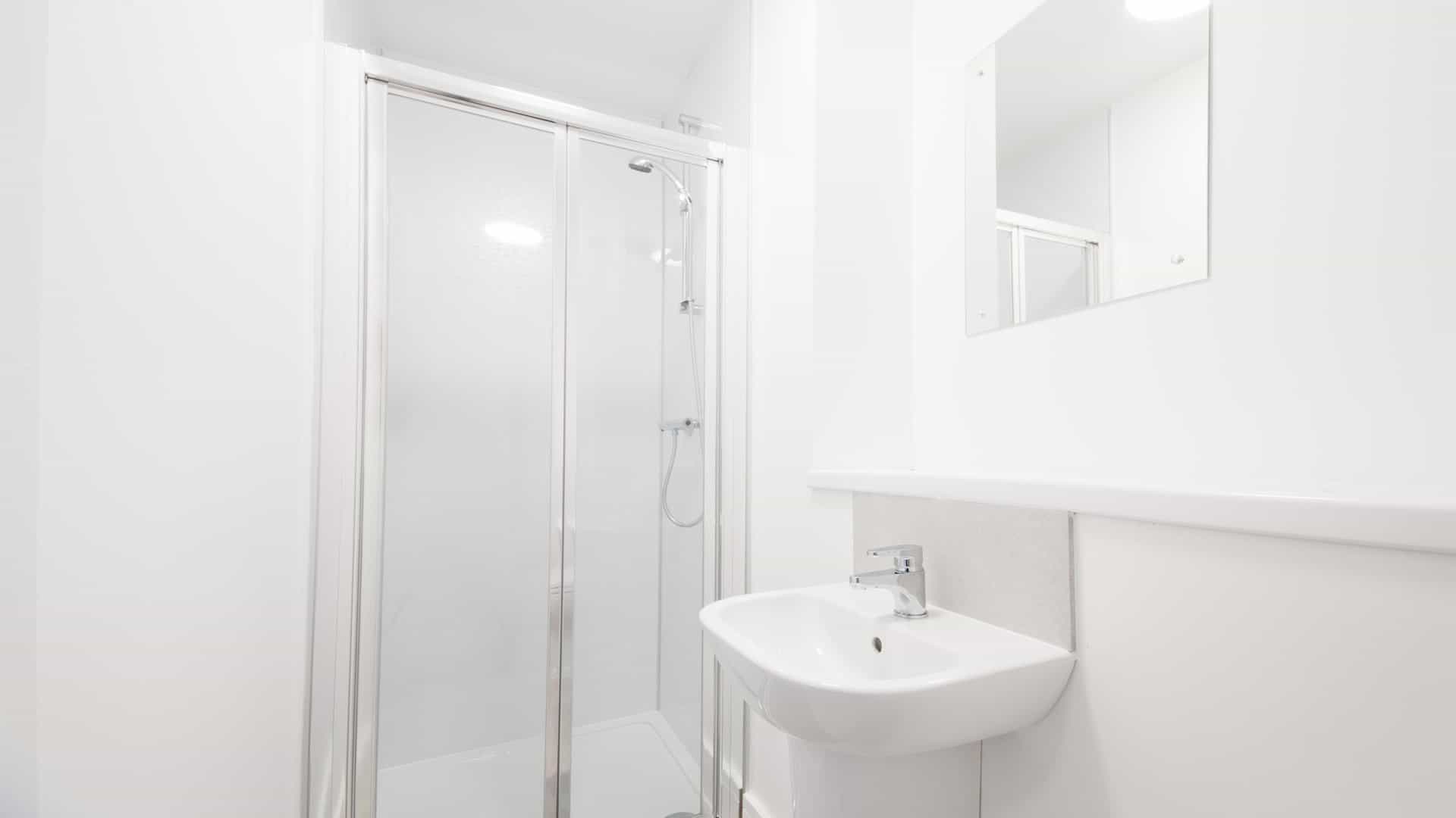 Villa Maria bathroom, with a sink and built-in shower