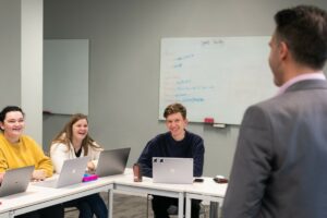 Students smiling at lecturer