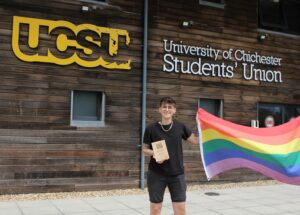 Rylee holding the National Pride flag