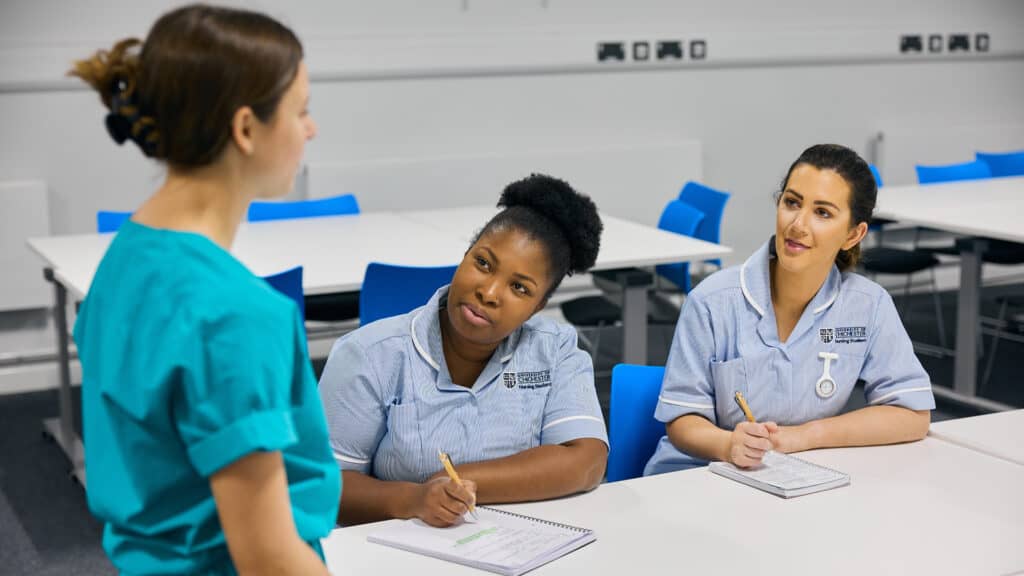 Nursing students sat learning in a classroom