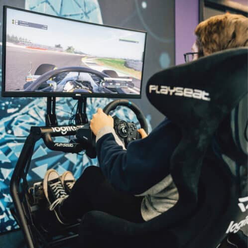 Esports student playing a racing game