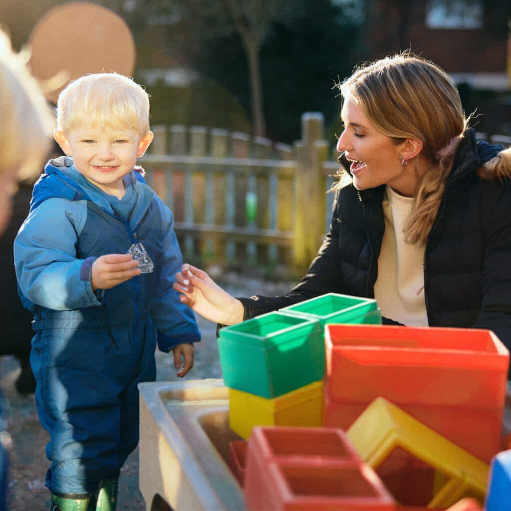 Student playing with a child