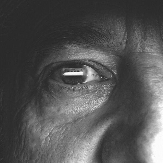 Forced Digitalisation Human eye with the reflcetion of a USB port