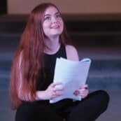 student reading from a script