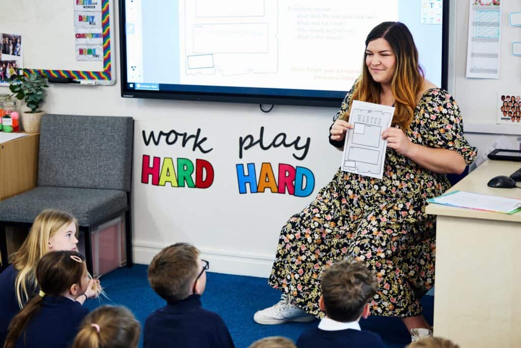 Teacher at the front of a primary school class