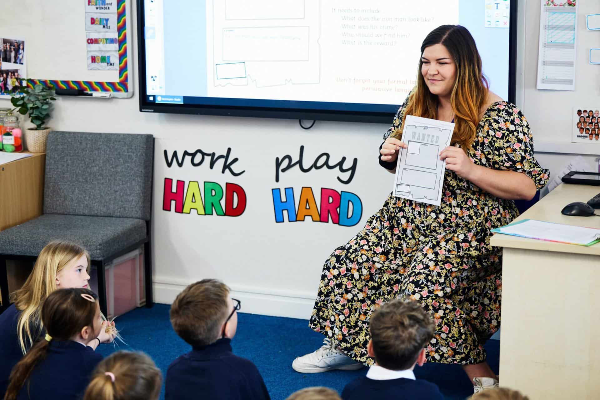 CHI UNI APRIL 2023 83 Teacher at the front of a primary school class