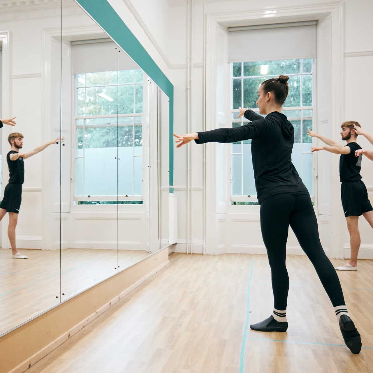 ballet student in front of mirror