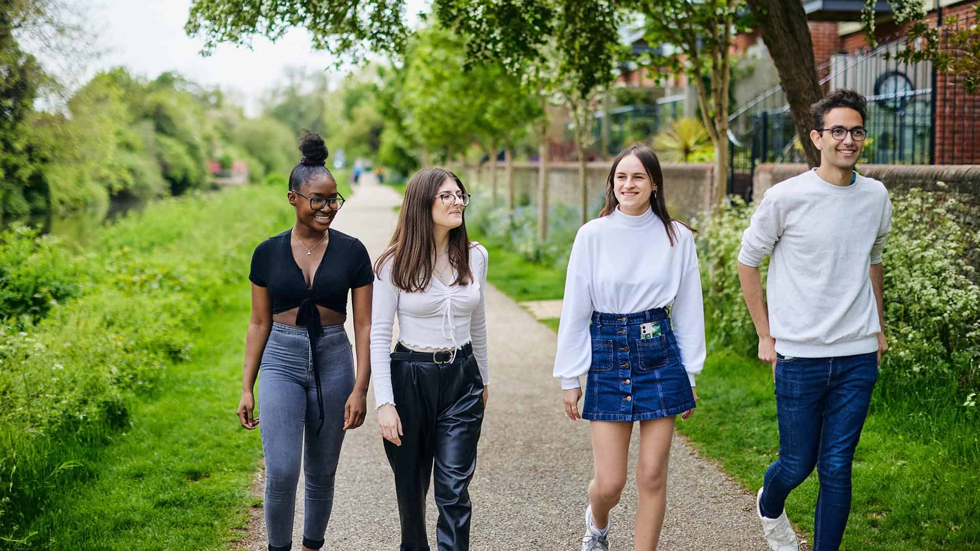 students walking along canal