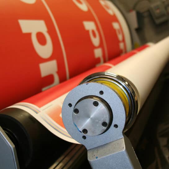 Printshop Header Image Printing press printing a large banner