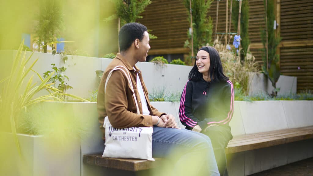 students sitting in courtyard talking