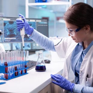 Biomedical Science student in lab using equipment