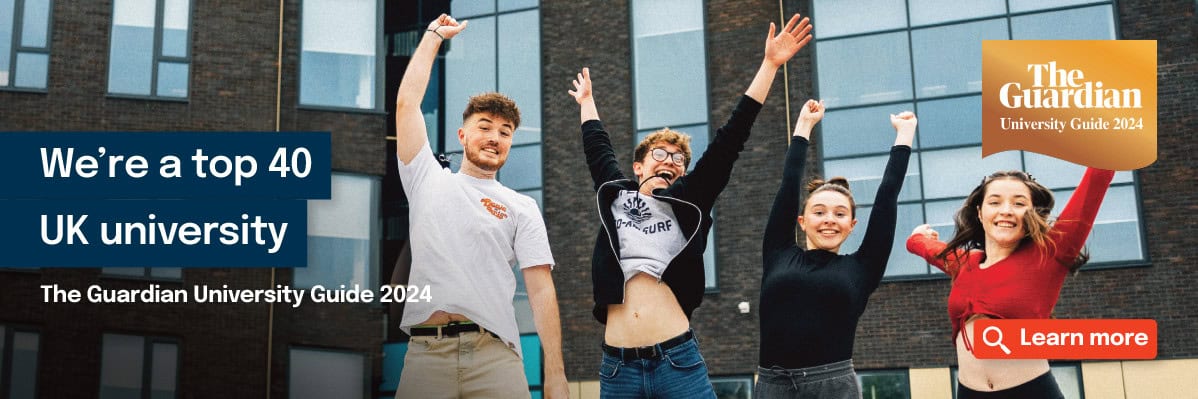 Four students jumping outside building. Copy that says 'We're a top 40 UK university, The Guardian University Guide 2024'