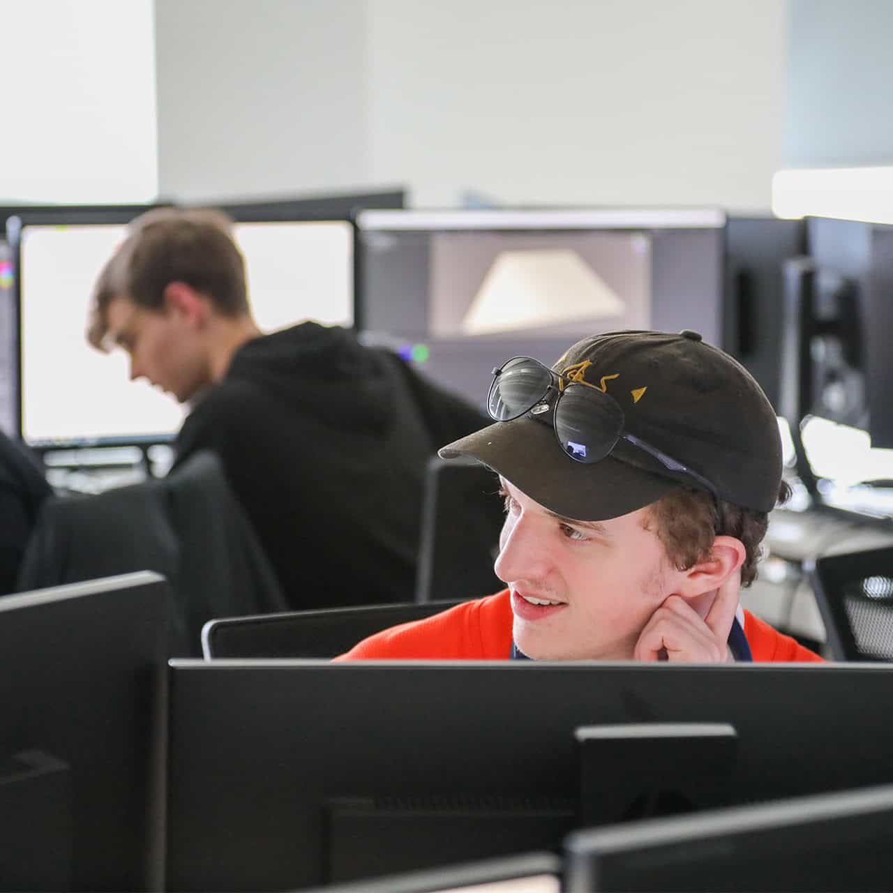 Game design student working on computer