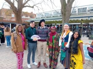 A group of students from different cultures in traditional dress