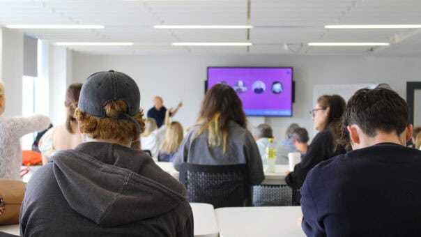 attendees sat listening to a talk on an Open Day