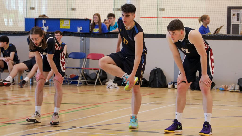 students playing basketball