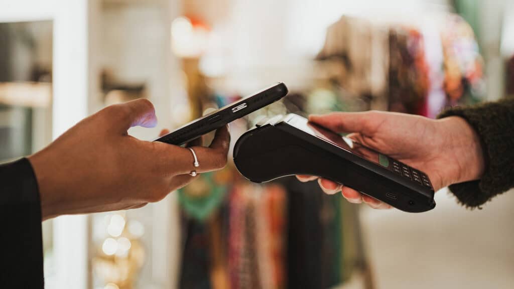 Student making a contactless payment