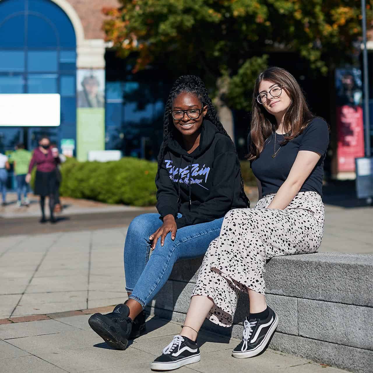Students sat outside Academic Building