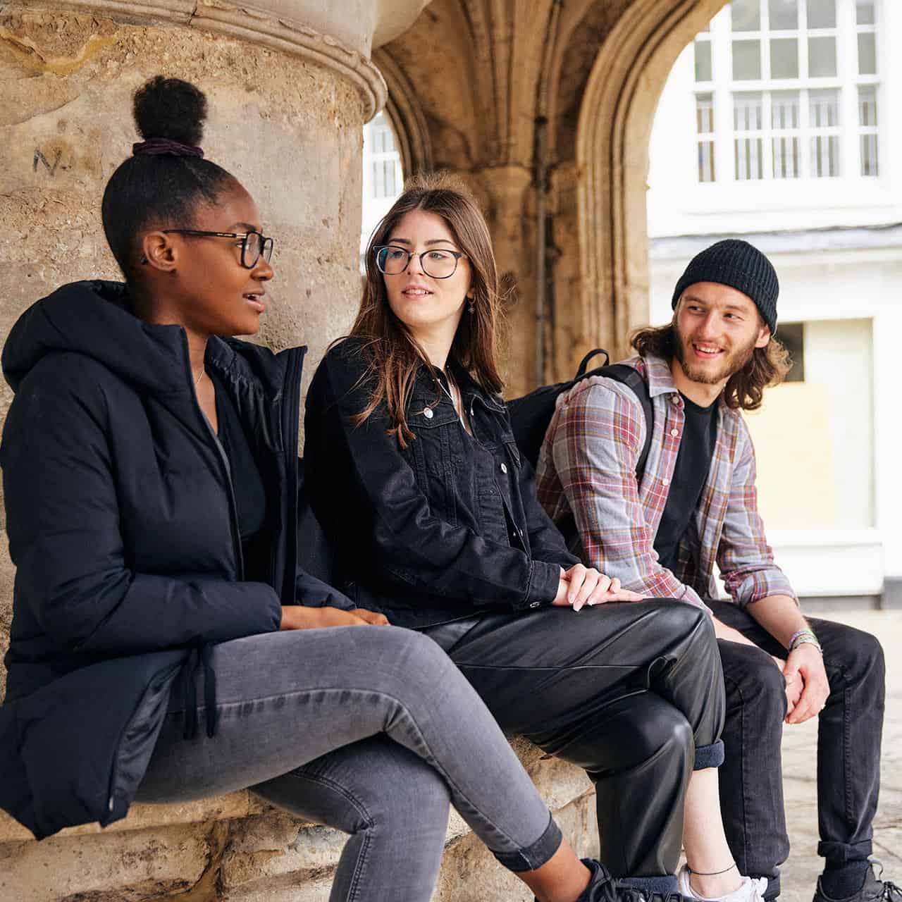 Students sat at Chichester Cross