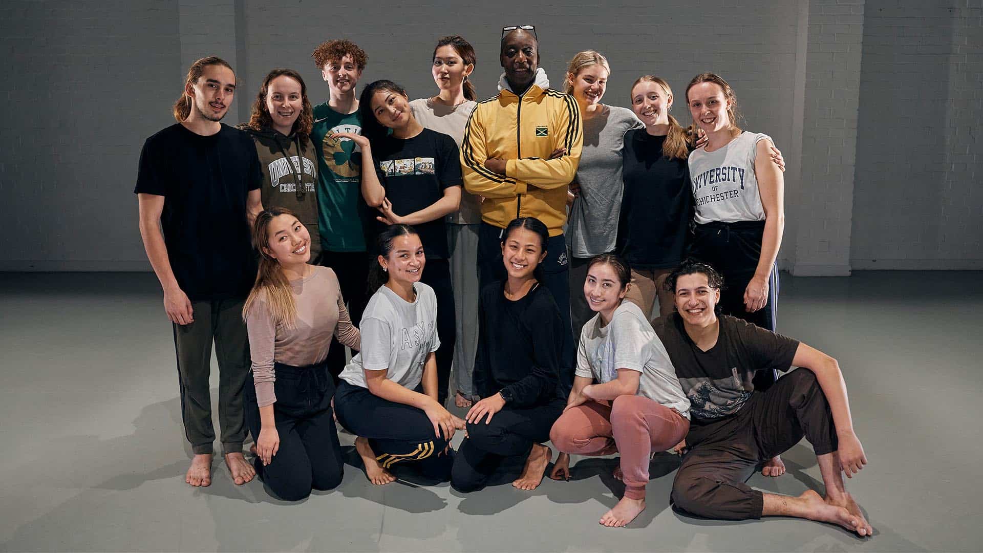 Dance students and their teacher posing