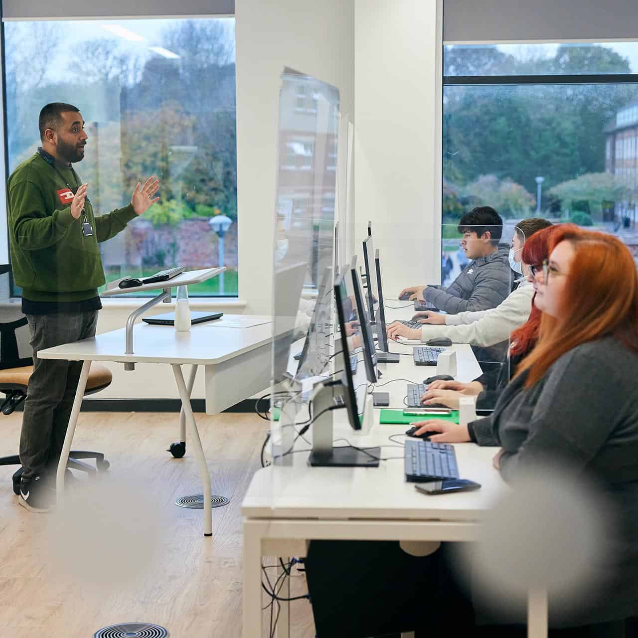 students sat at computers in an engineering lecture