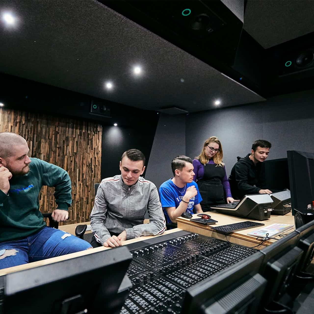 a group of students together in the editing suite